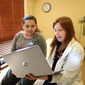 Anneliese and Patient A provider discusses results with a patient.